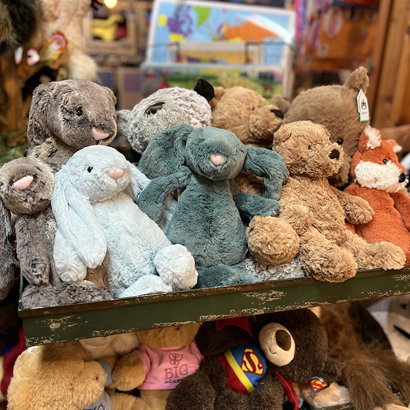 Shelf of Jellycat stuffed animals at Fabula